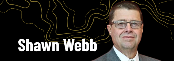 Header banner with a portrait of a man in a suit and glasses next to the name Shawn Webb on a black, contour-line background.